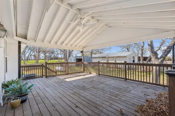 a view of a balcony with wooden floor