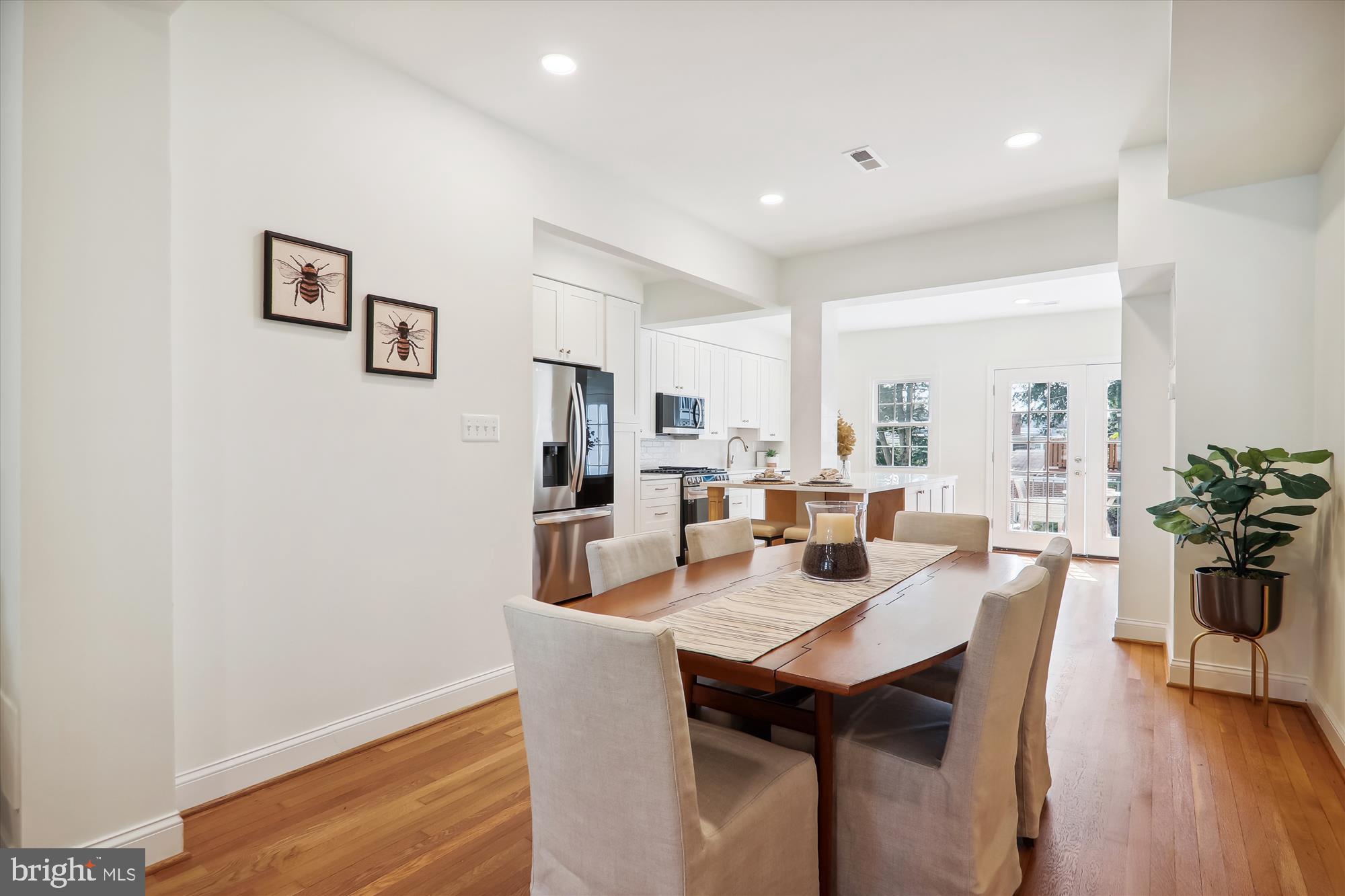 2462 Tunlaw Road Northwest Washington, DC 20007 - Photo 11 of 56 a view of a dining room with furniture and wooden floor