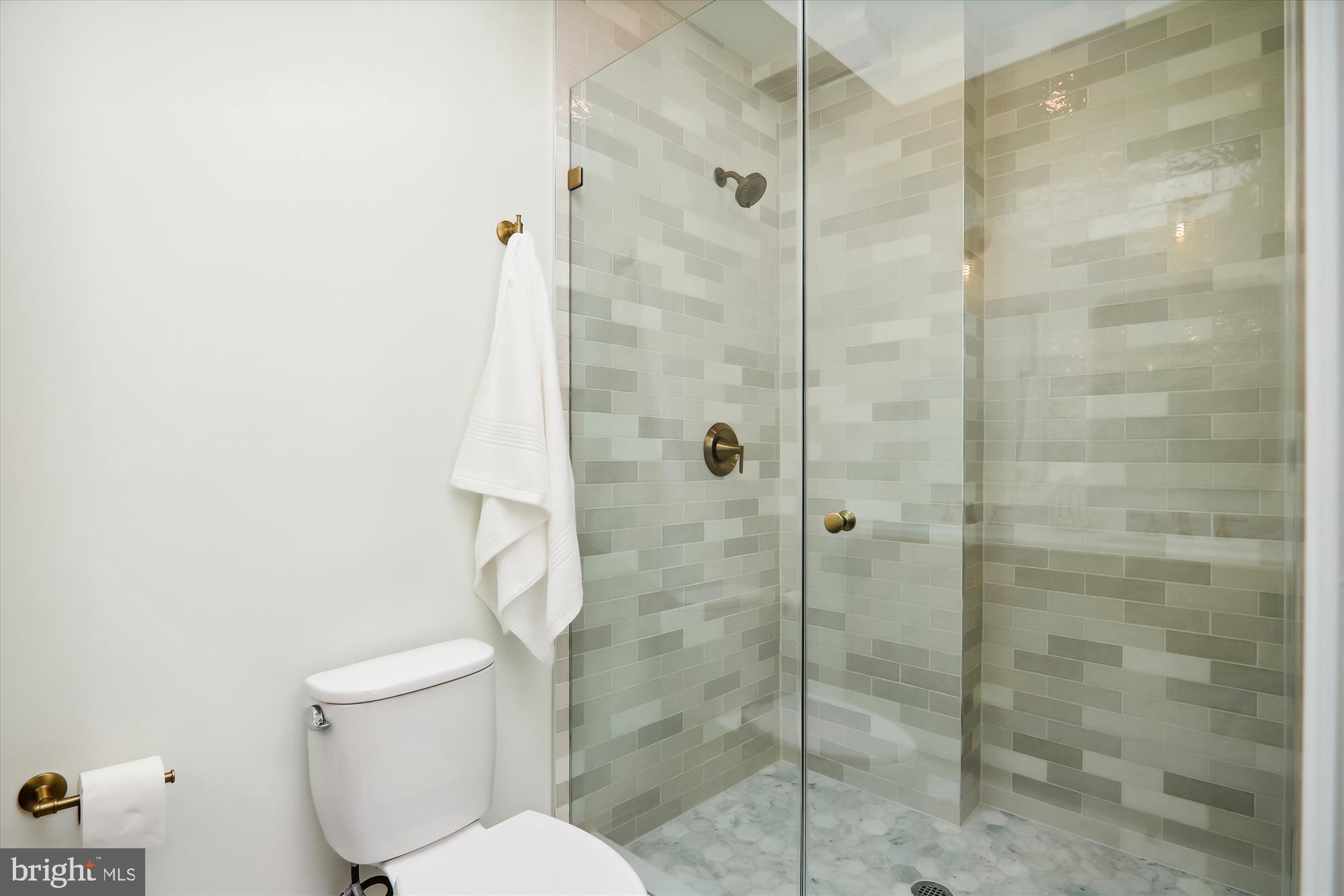 2462 Tunlaw Road Northwest Washington, DC 20007 - Photo 28 of 56 a bathroom with a toilet and shower