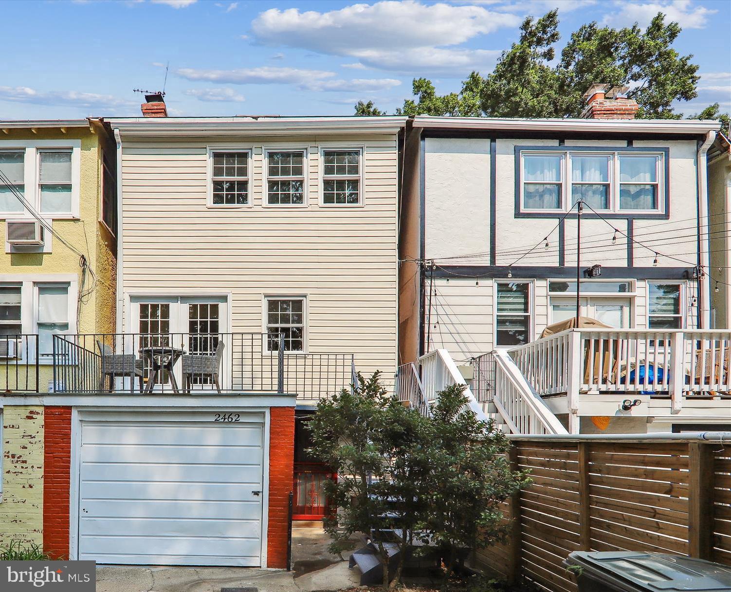2462 Tunlaw Road Northwest Washington, DC 20007 - Photo 43 of 56 a front view of a house with a yard