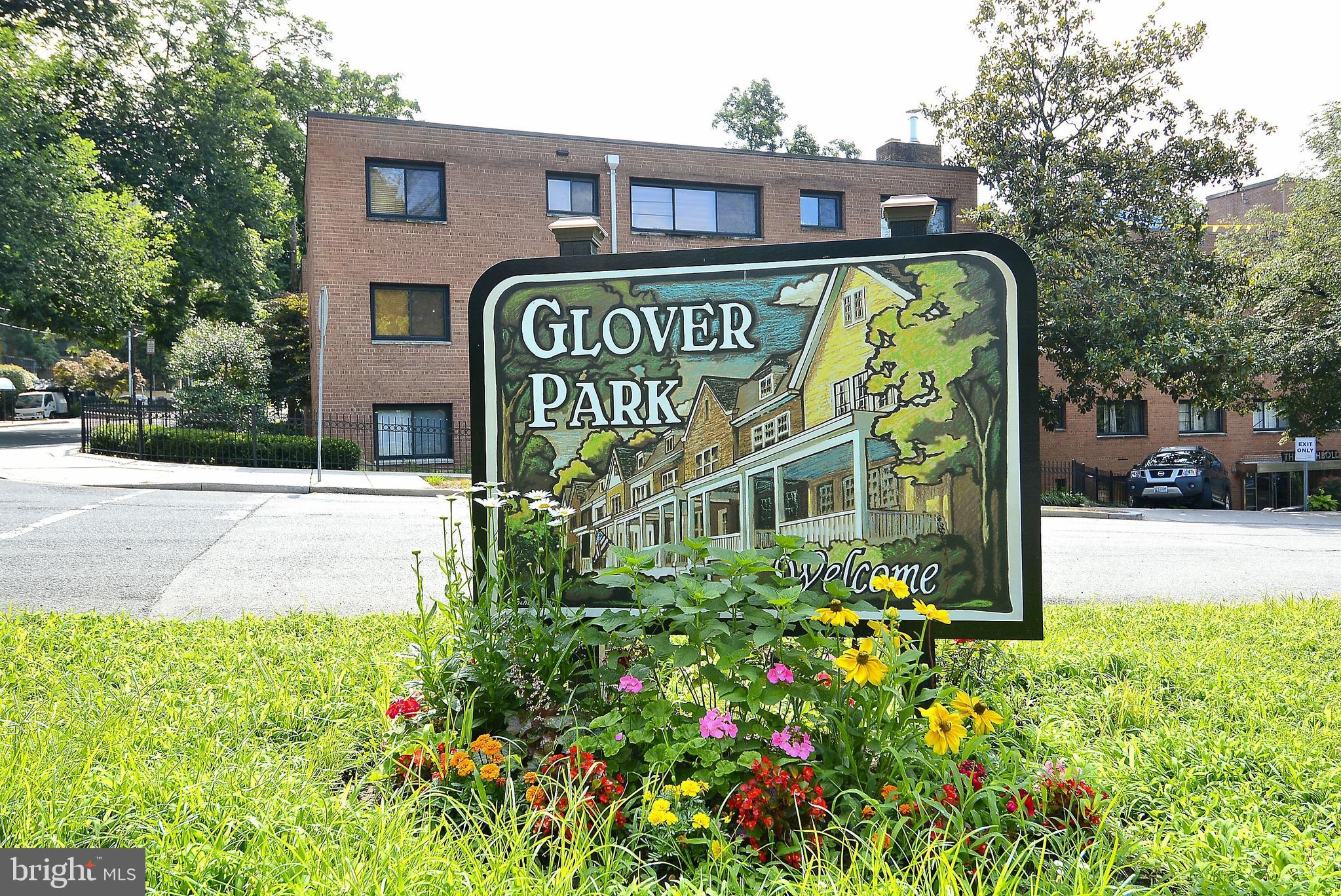 2462 Tunlaw Road Northwest Washington, DC 20007 - Photo 45 of 56 a sign on the side of a building