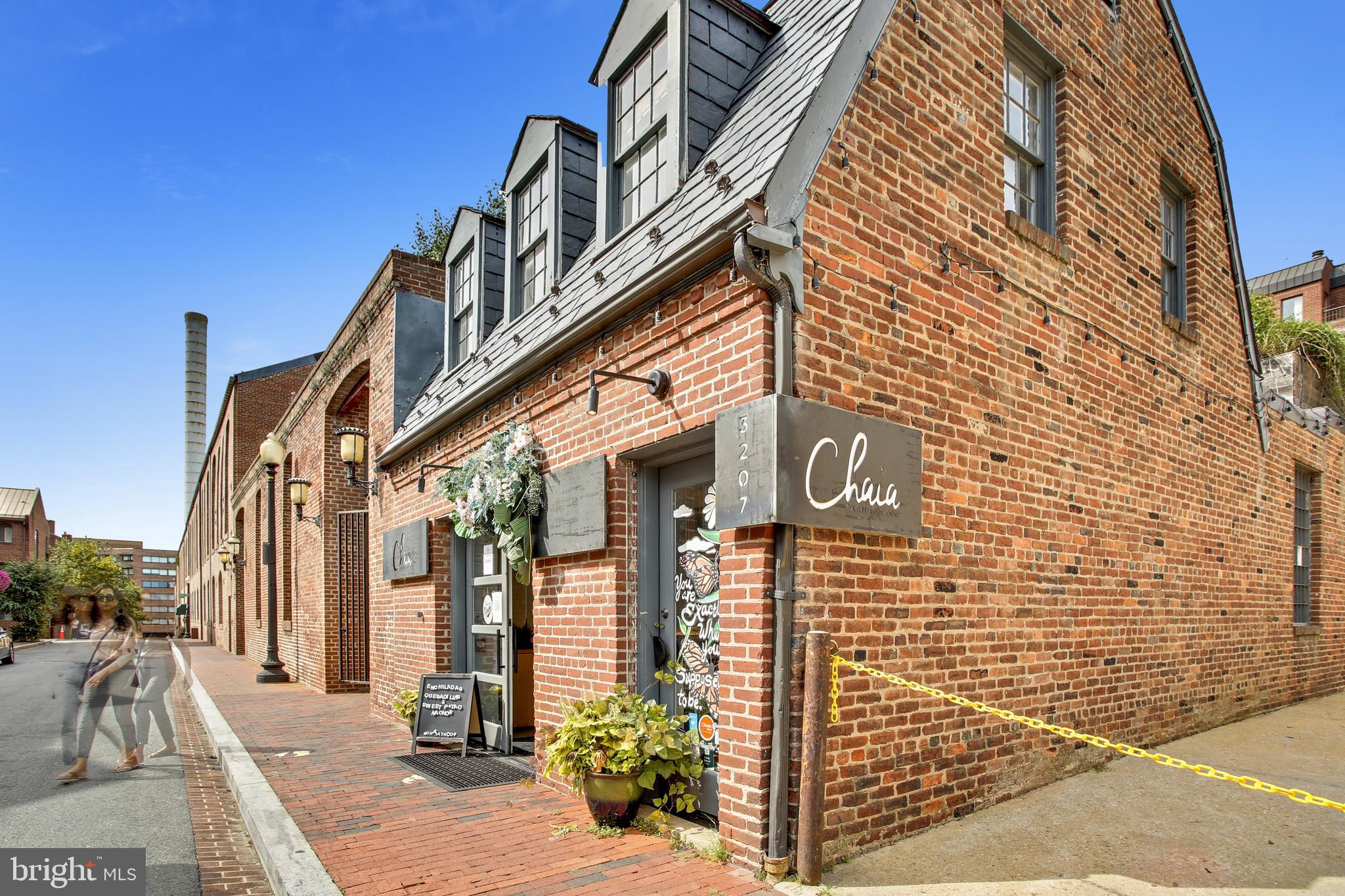 2462 Tunlaw Road Northwest Washington, DC 20007 - Photo 52 of 56 a view of a brick building with many windows