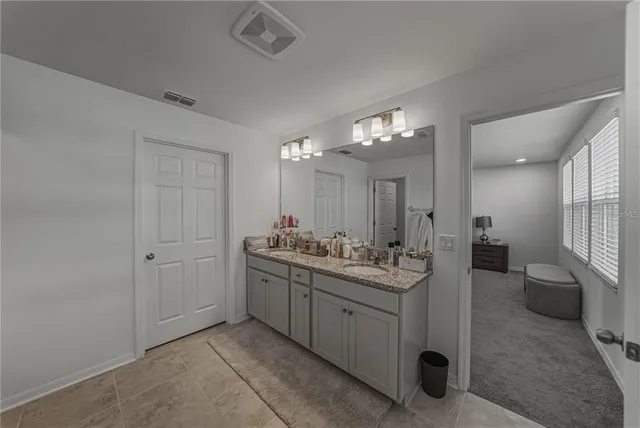 a living room with furniture and windows