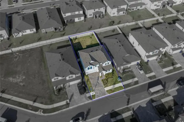 an aerial view of a building with outdoor space