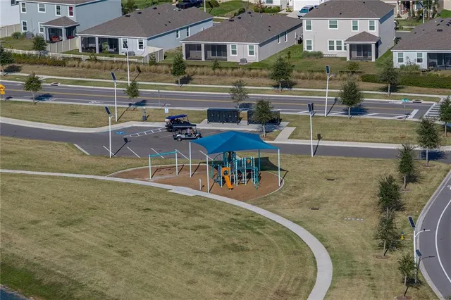 an aerial view of a house with a swimming pool yard and outdoor seating