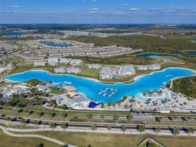 an aerial view of a house with a ocean view
