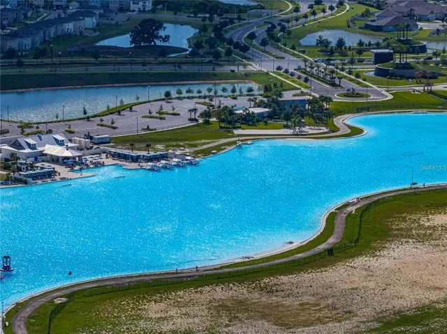 an aerial view of a pool patio swimming pool and outdoor seating