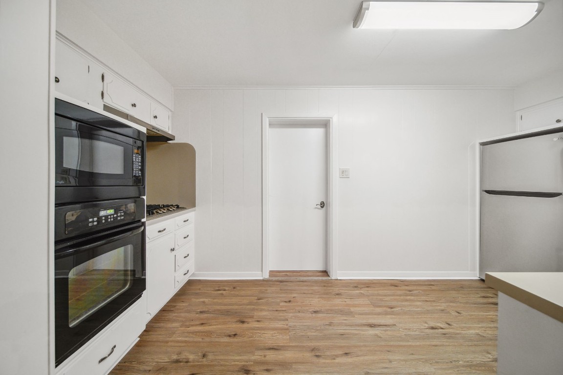 2019 North Thompson Street, Unit A Conroe, TX 77301 - Photo 4 of 17 Kitchen features gas cooktop, built in microwave and oven with a walk in pantry.
