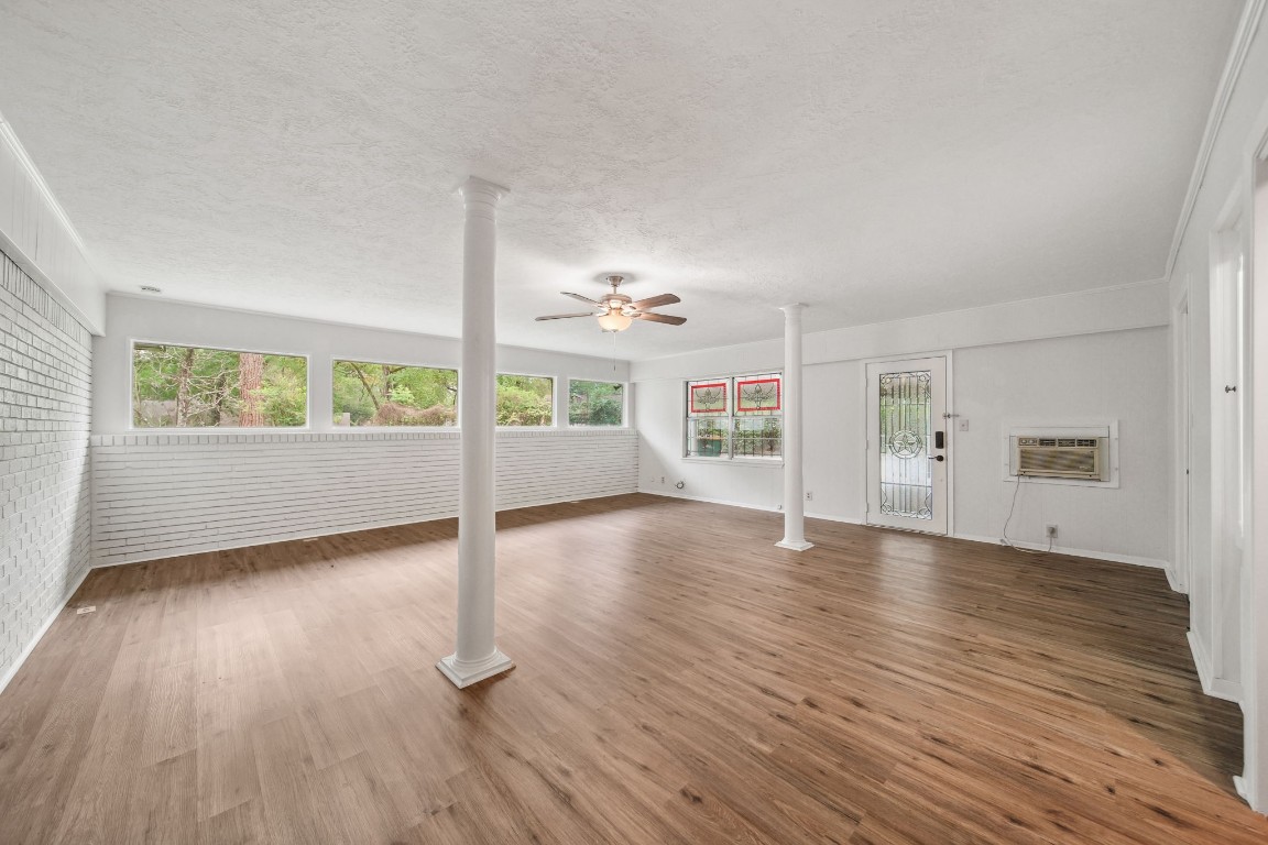 2019 North Thompson Street, Unit A Conroe, TX 77301 - Photo 8 of 17 Flexible room could be used as additional bedroom, office, work out with desk nook, display case, and wet bar.