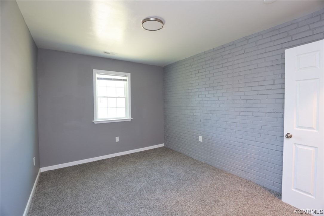 3309 Croydon Road Richmond, VA 23223 - Photo 17 of 21 Carpeted empty room with brick wall