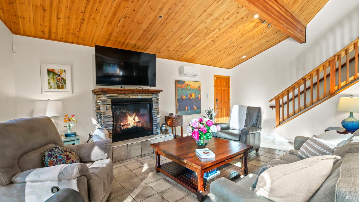 11081 Van Dorn Reservoir Road, Unit 1 Middletown, CA 95461 - Photo 11 of 68 a living room with furniture a flat screen tv and a fireplace