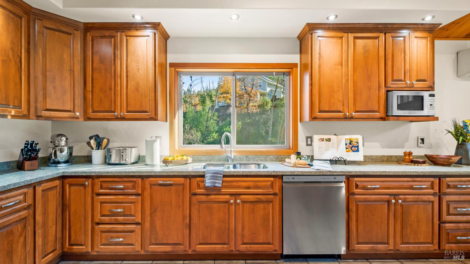 11081 Van Dorn Reservoir Road, Unit 1 Middletown, CA 95461 - Photo 15 of 68 a kitchen with granite countertop a sink window and cabinets