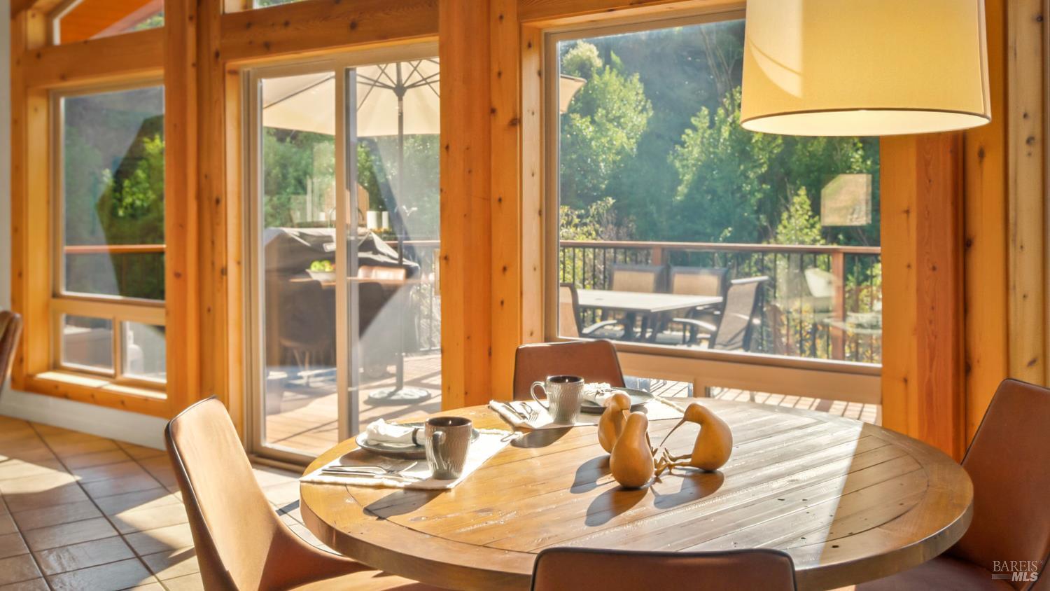 11081 Van Dorn Reservoir Road, Unit 1 Middletown, CA 95461 - Photo 10 of 68 a view of a dining room with furniture a chandelier and wooden floor