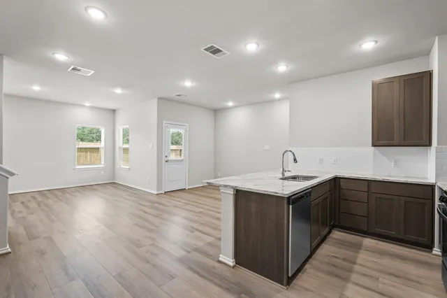 a kitchen with a sink and cabinets