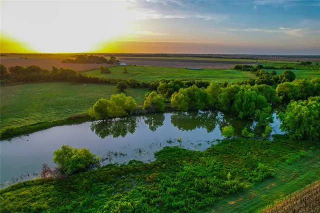 a view of a lake with a yard