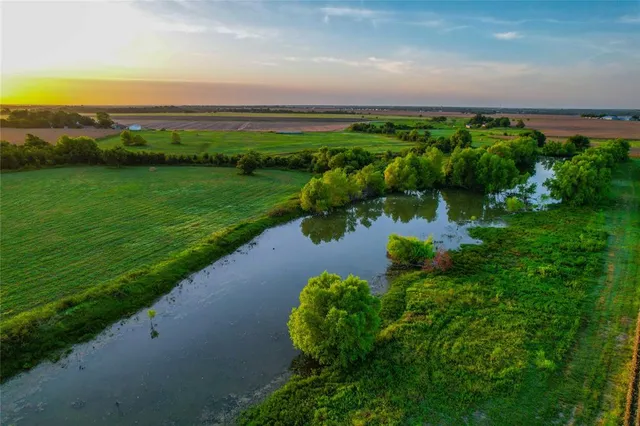 a view of a lake with a yard