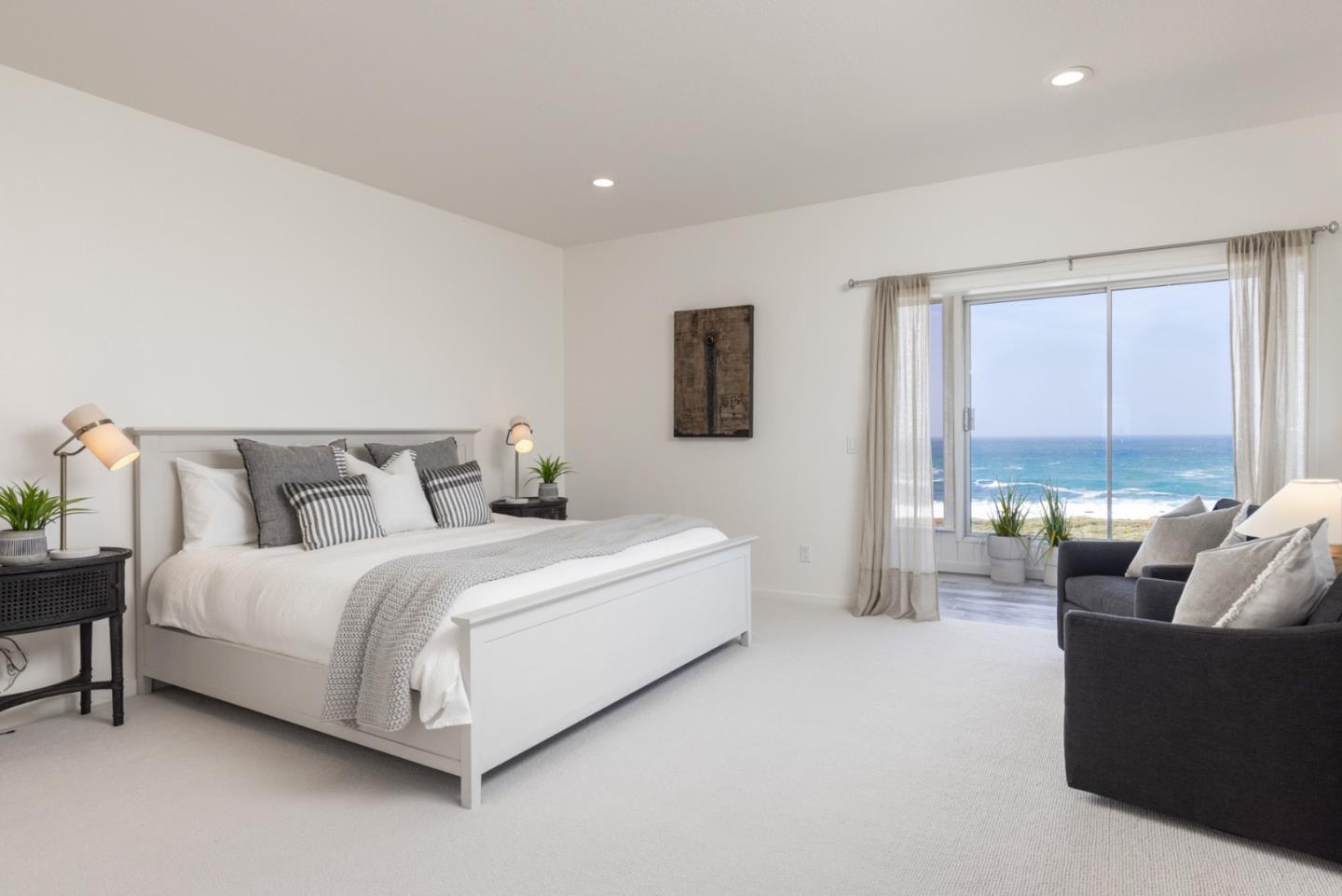 2715 Ribera Road Carmel, CA 93923 - Photo 18 of 41 a spacious bedroom with a bed and a couch