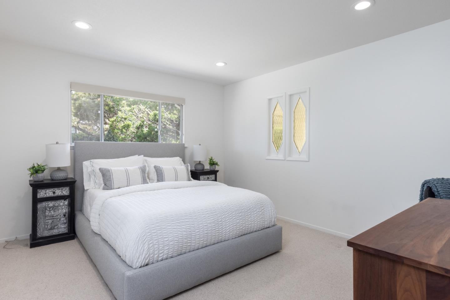 2715 Ribera Road Carmel, CA 93923 - Photo 24 of 41 a bedroom with a bed and a window