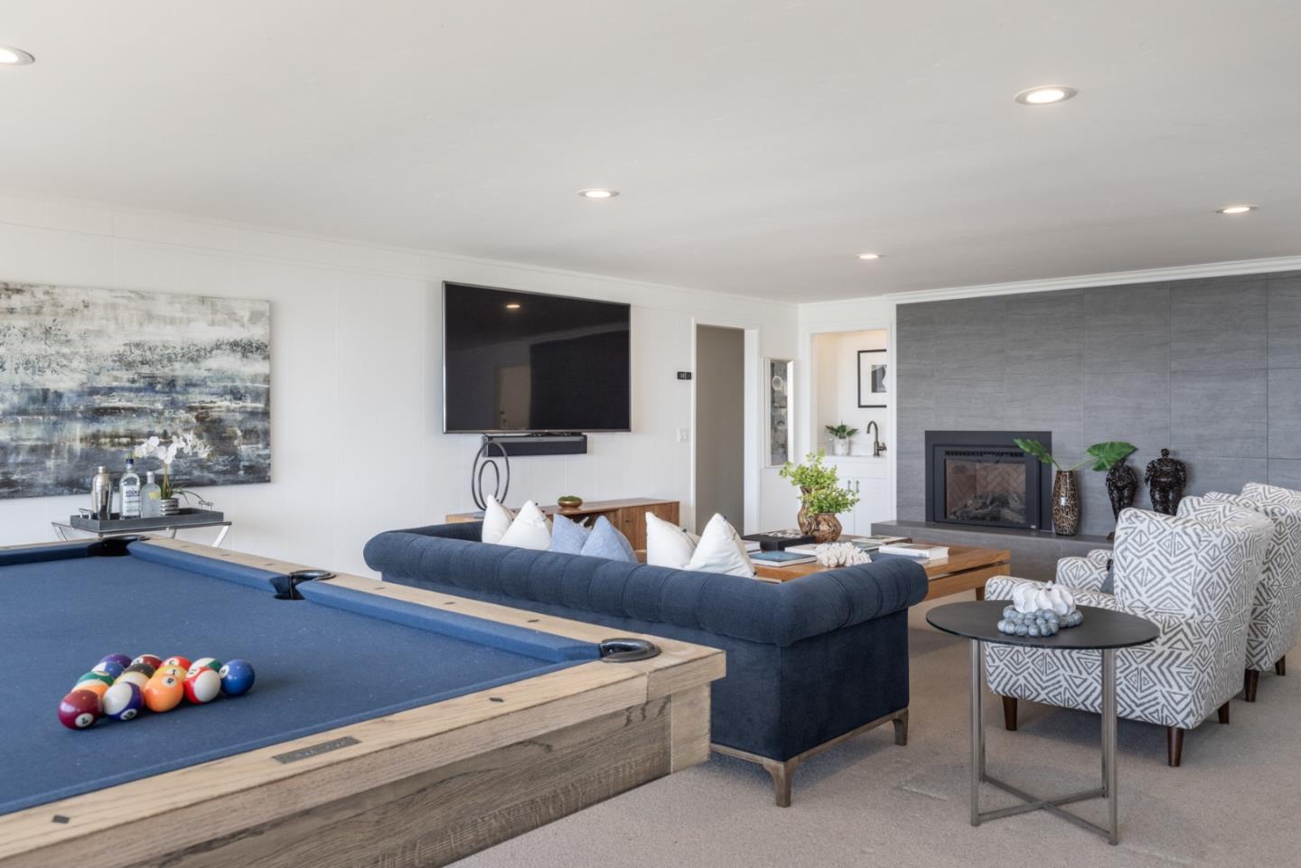 2715 Ribera Road Carmel, CA 93923 - Photo 26 of 41 a living room with furniture and a flat screen tv