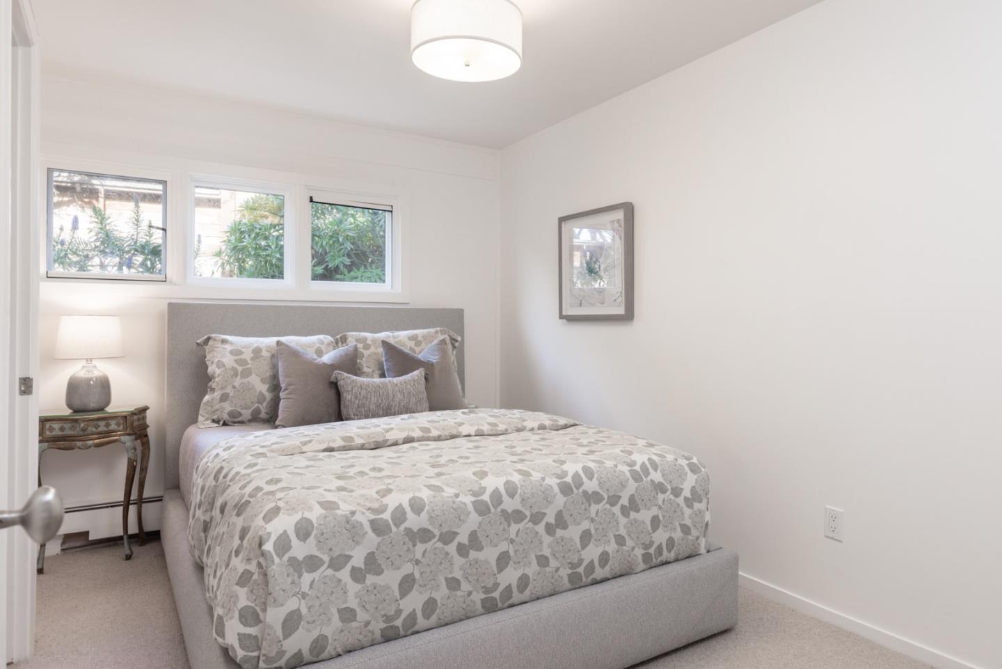 2715 Ribera Road Carmel, CA 93923 - Photo 28 of 41 a bedroom with a bed and a window