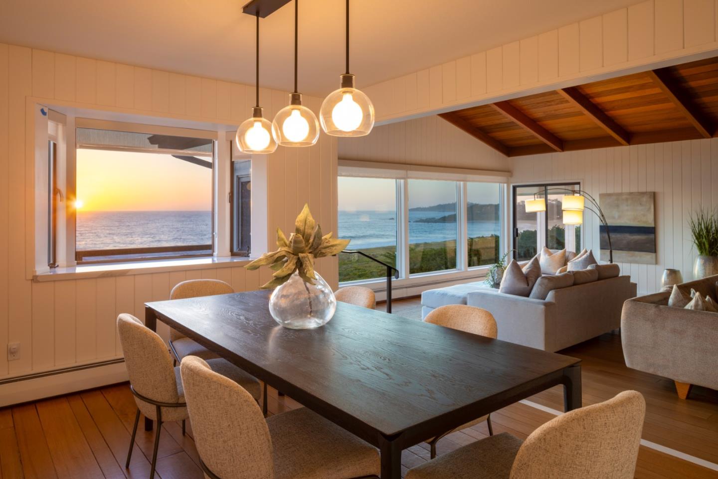2715 Ribera Road Carmel, CA 93923 - Photo 36 of 41 a view of a dining room with furniture wooden floor and chandelier