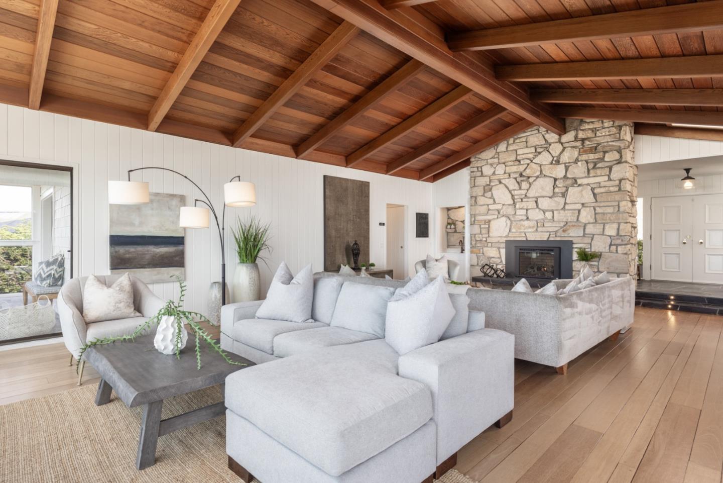 2715 Ribera Road Carmel, CA 93923 - Photo 6 of 41 a living room with furniture and a fireplace