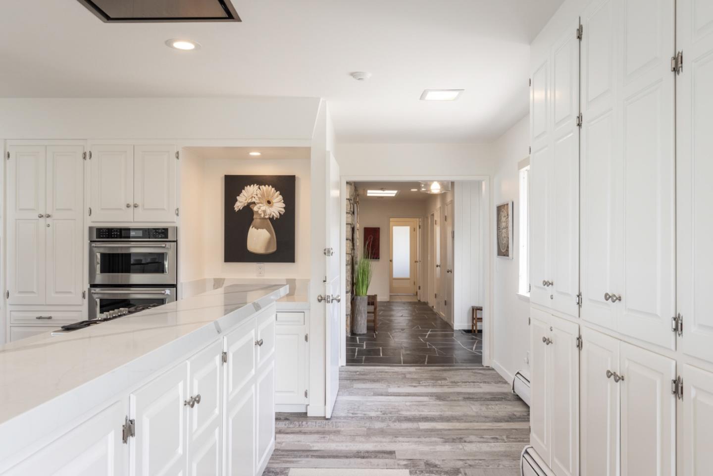 2715 Ribera Road Carmel, CA 93923 - Photo 9 of 41 a view of a hallway with wooden floor