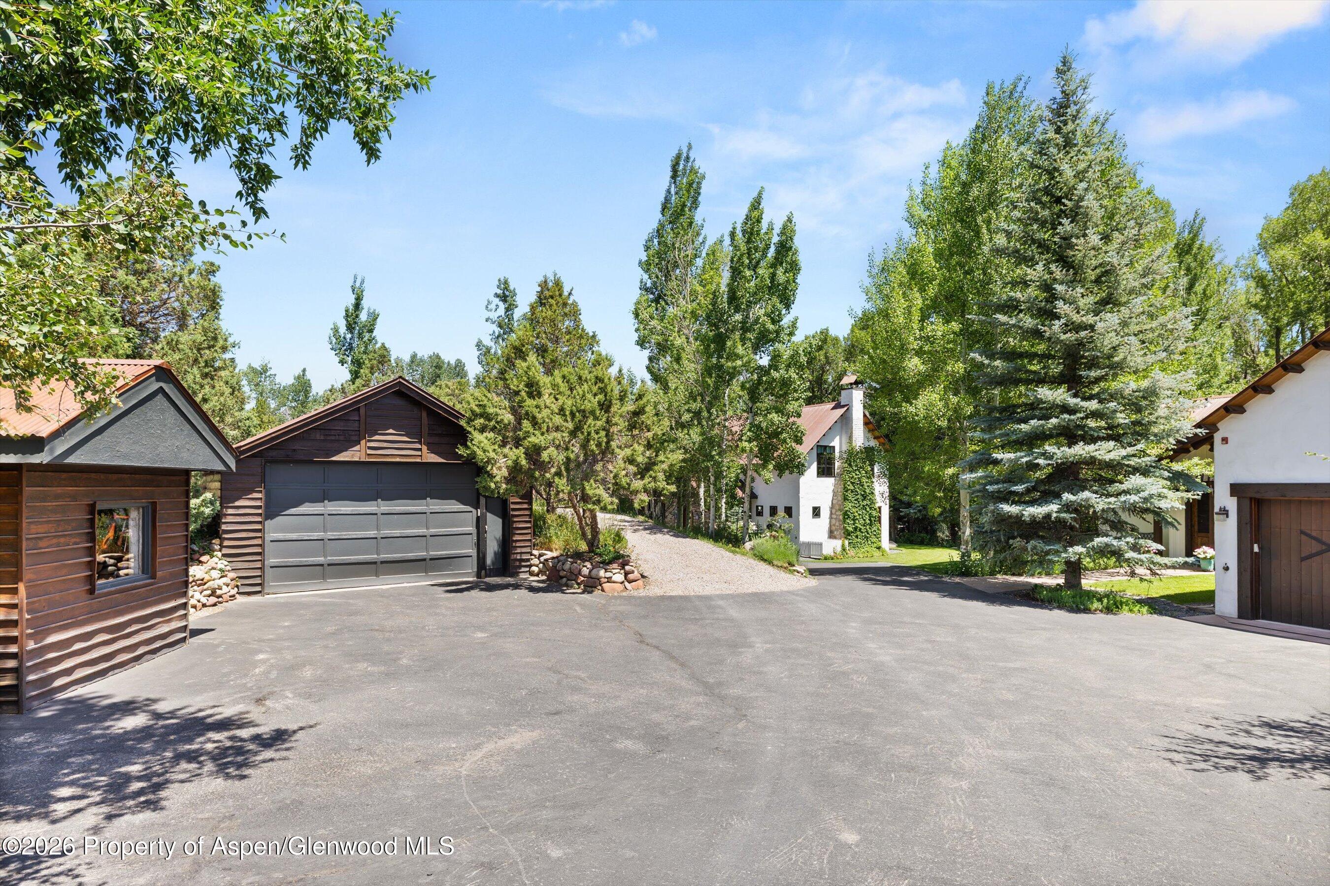 256 Twining Flats Road Aspen, CO 81611 - Photo 34 of 42 front view of a house with a street