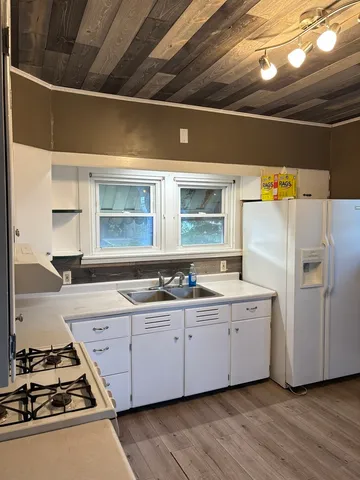 a kitchen with a stove and a refrigerator