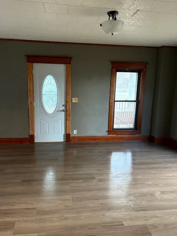a view of a livingroom with wooden floor