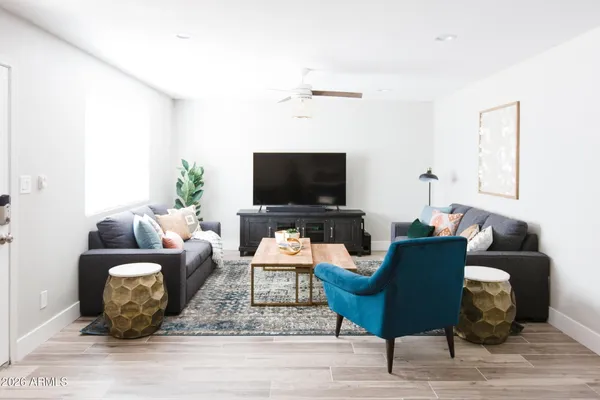 a living room with furniture and a flat screen tv