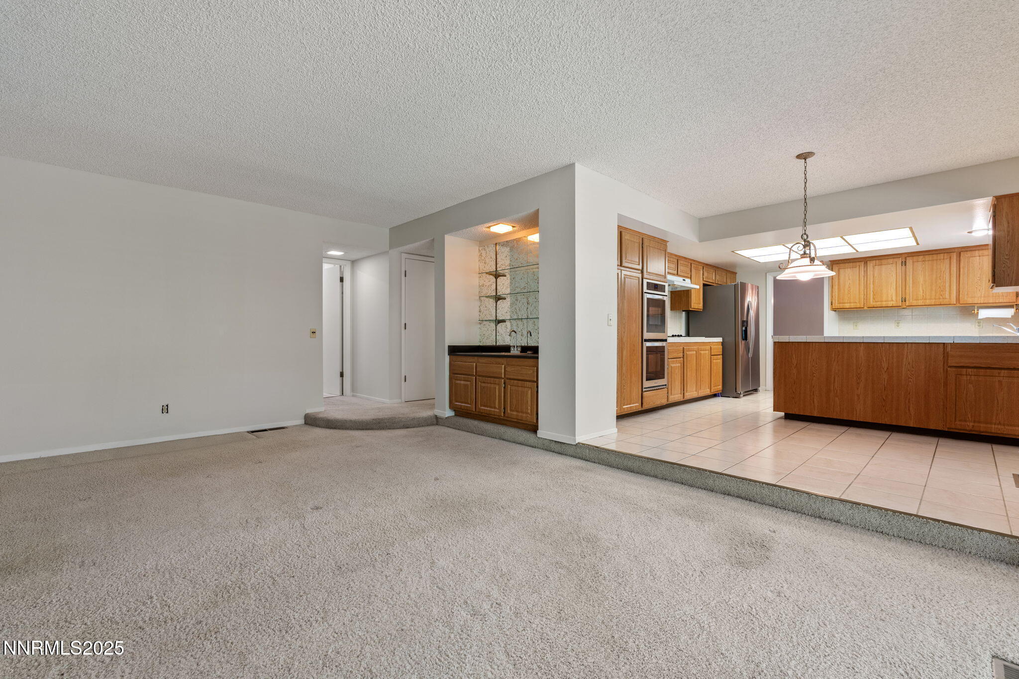 4899 Cool Springs Drive Reno, NV 89509 - Photo 15 of 41 an empty room with furniture and windows