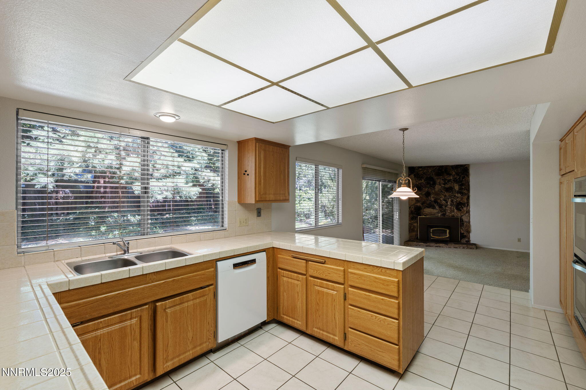 4899 Cool Springs Drive Reno, NV 89509 - Photo 16 of 41 a kitchen with a sink cabinets and window