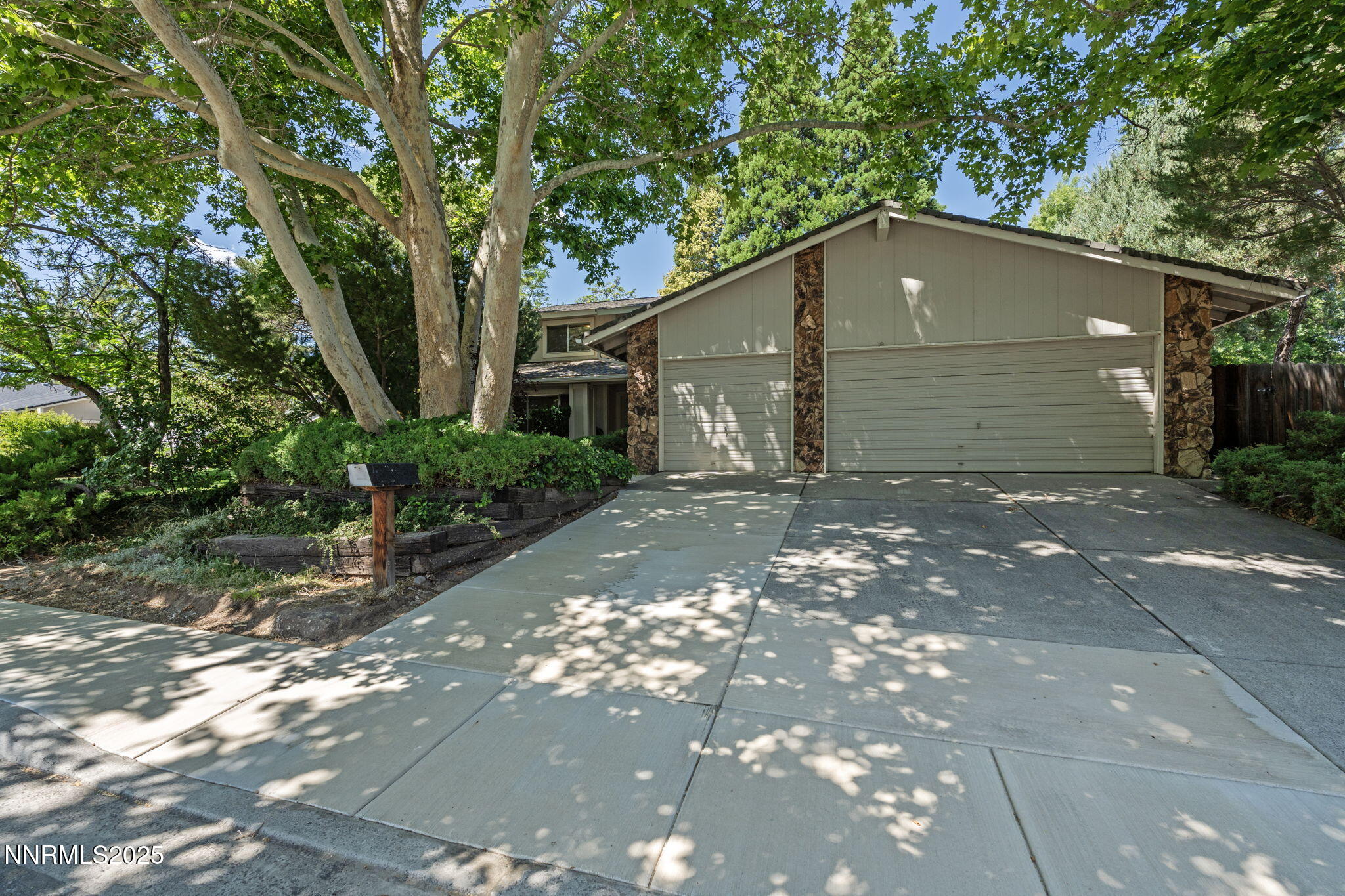 4899 Cool Springs Drive Reno, NV 89509 - Photo 2 of 41 a house that has tree in front of it