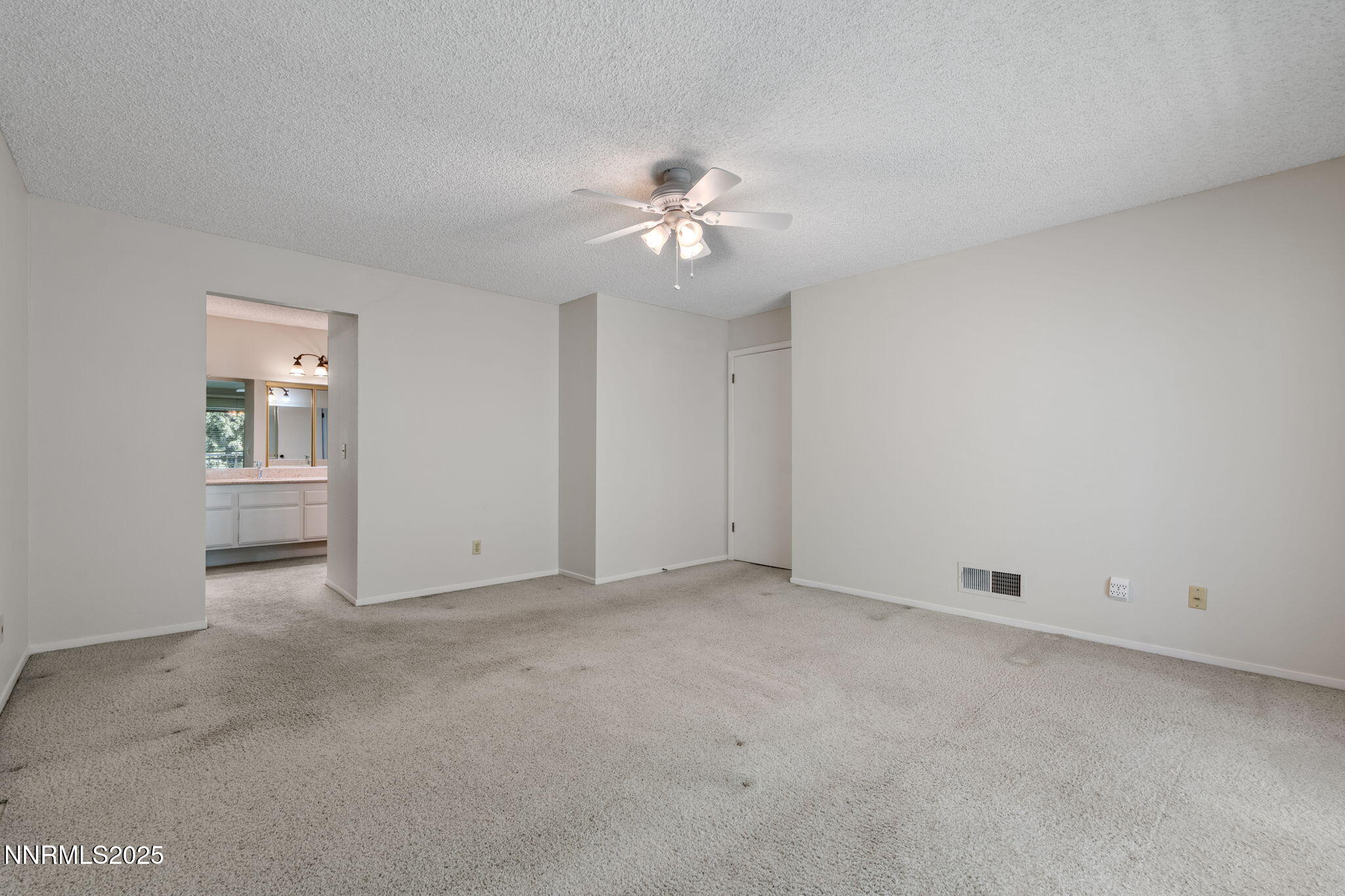 4899 Cool Springs Drive Reno, NV 89509 - Photo 25 of 41 an empty room with a ceiling fan and a window