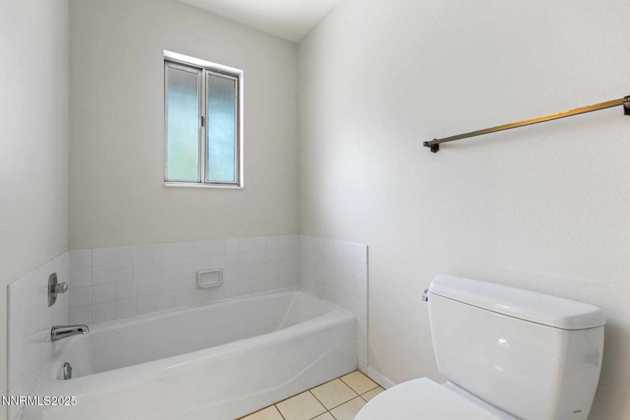 4899 Cool Springs Drive Reno, NV 89509 - Photo 27 of 41 a bath room with a toilet and a bath tub