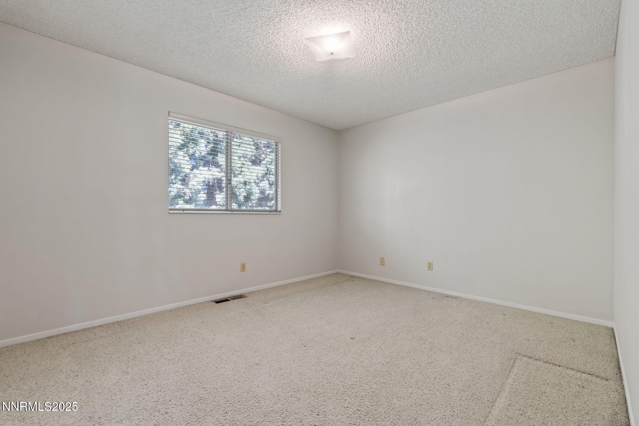 4899 Cool Springs Drive Reno, NV 89509 - Photo 28 of 41 an empty room with windows