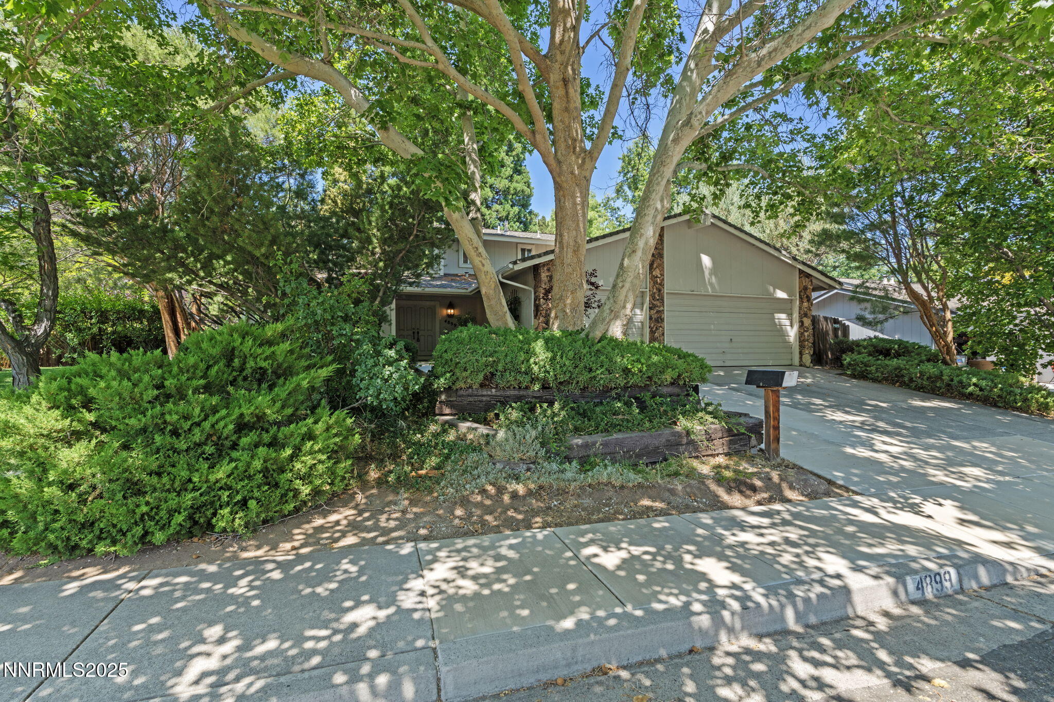 4899 Cool Springs Drive Reno, NV 89509 - Photo 3 of 41 a front view of a house with a yard