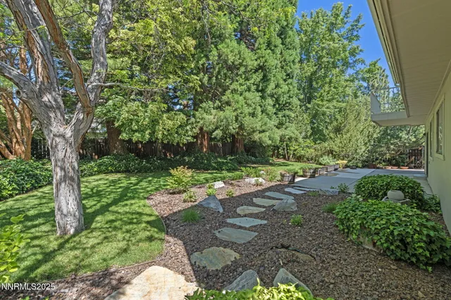 a view of backyard with green space