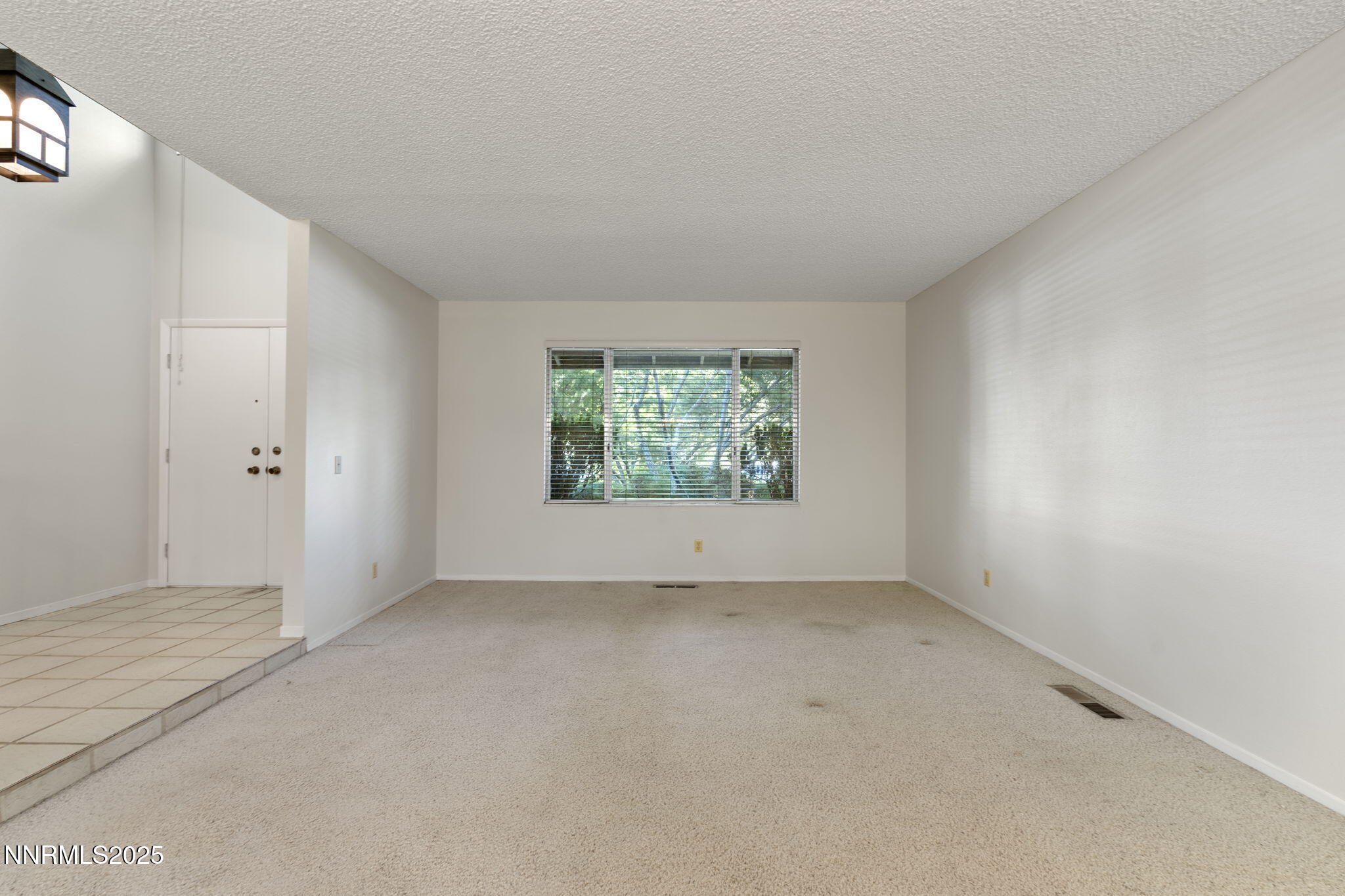 4899 Cool Springs Drive Reno, NV 89509 - Photo 4 of 41 an empty room with windows