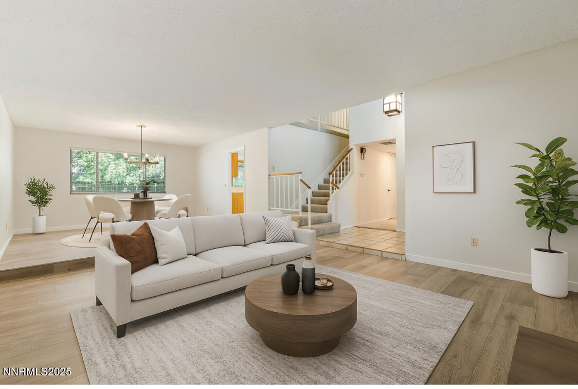 4899 Cool Springs Drive Reno, NV 89509 - Photo 6 of 41 a living room with furniture and a potted plant