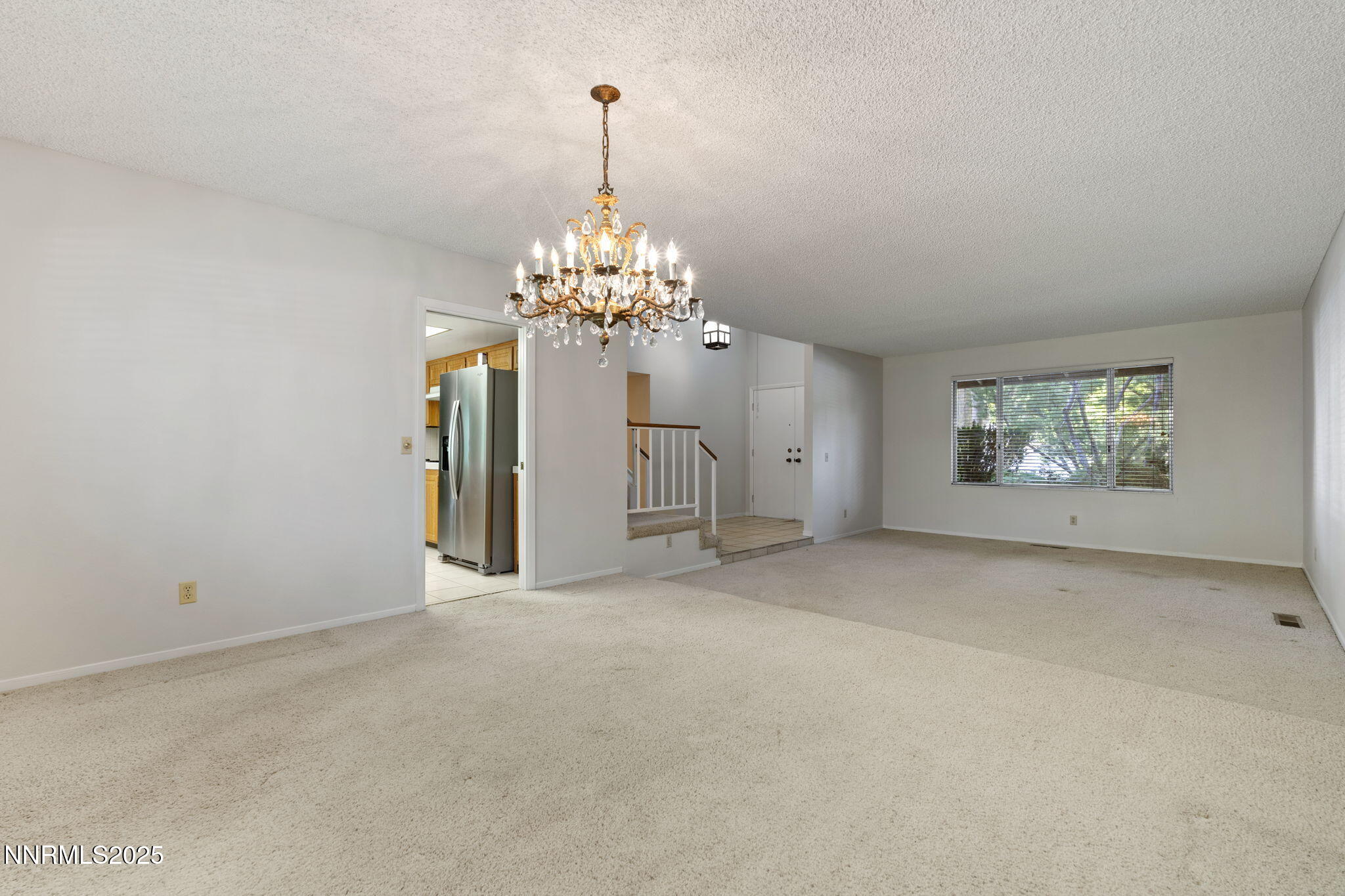 4899 Cool Springs Drive Reno, NV 89509 - Photo 7 of 41 a view of a chandelier in big room and chandelier