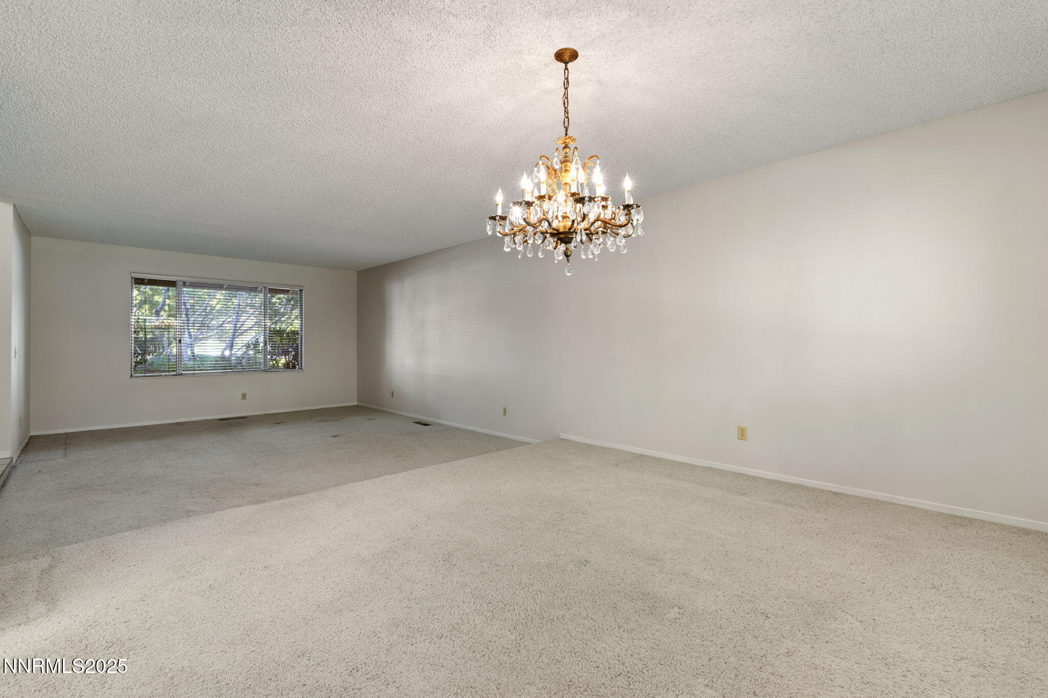 4899 Cool Springs Drive Reno, NV 89509 - Photo 8 of 41 a view of a chandelier in big room and chandelier