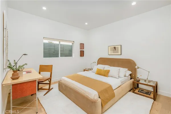 a bedroom with a bed and a table