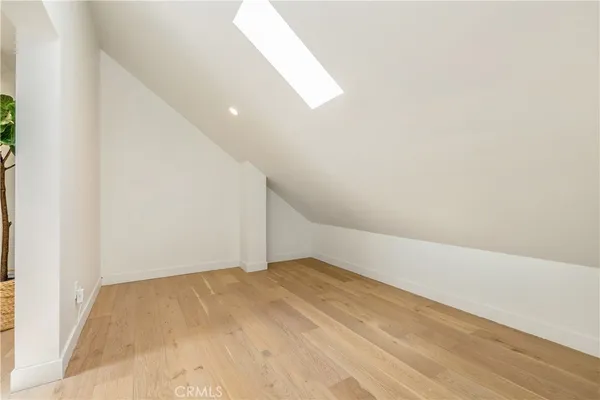 an empty room with wooden floor