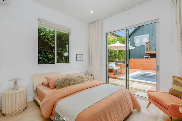 a bedroom with a large bed and a couch
