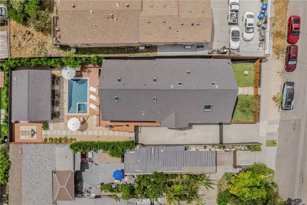 an aerial view of a house with a swimming pool