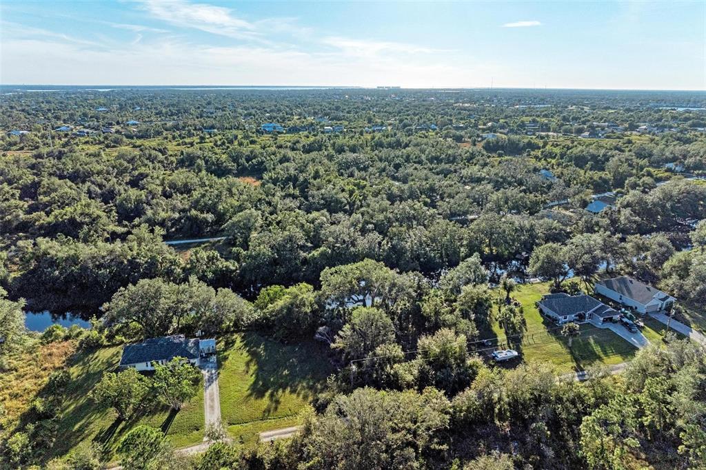 27401 Neaptide Drive Punta Gorda, FL 33983 - Photo 14 of 16 an aerial view of multiple house