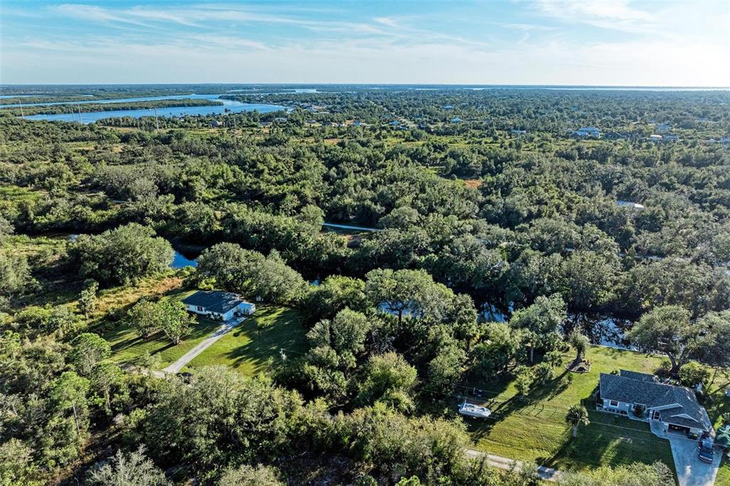 27401 Neaptide Drive Punta Gorda, FL 33983 - Photo 6 of 16 an aerial view of a houses with a yard