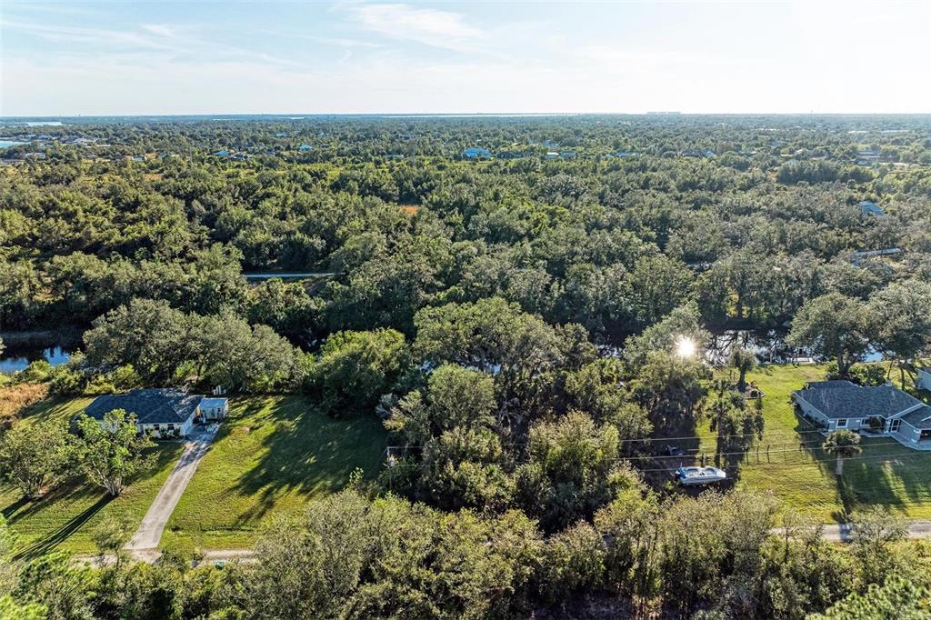 27401 Neaptide Drive Punta Gorda, FL 33983 - Photo 7 of 16 an aerial view of residential houses with outdoor space